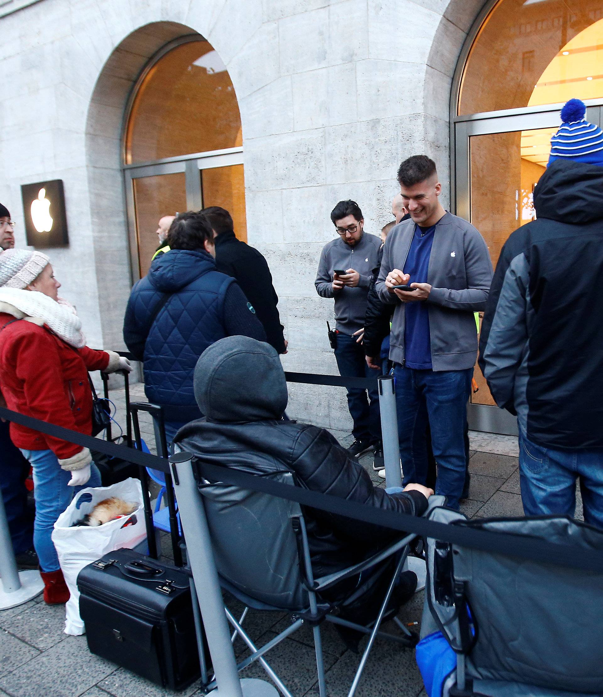 People queue for the iPhone X launch outside the Apple store in Berlin