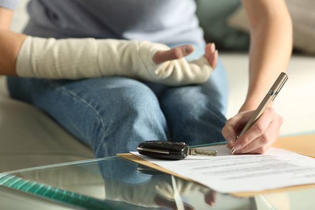 Close,Up,Of,A,Lady,Hands,With,Broken,Arm,Signing