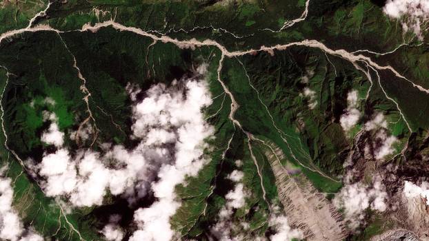 Satellite images show torrent of rock and ice high in Nepalese mountain valley after Nepal-China disaster