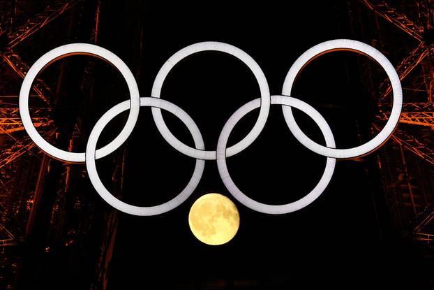 The moon is pictured with the Olympic rings on the Eiffel Tower ahead the Paris 2024 Olympic and Paralympic Games in Paris
