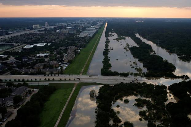 The Addicks reservoir is seen to the right full of rain water brought by Tropical Storm Harvey in West Houston