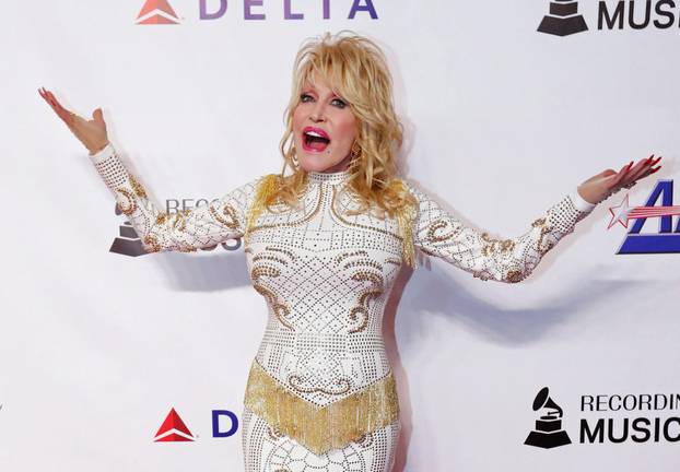 FILE PHOTO: Dolly Parton attends a red carpet gala event honoring her as the MusiCares person of the year in Los Angeles