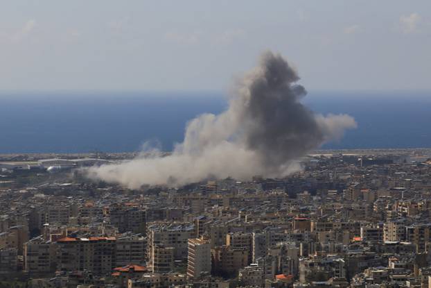 Smoke rises following an Israeli strike on the southern suburbs of Beirut