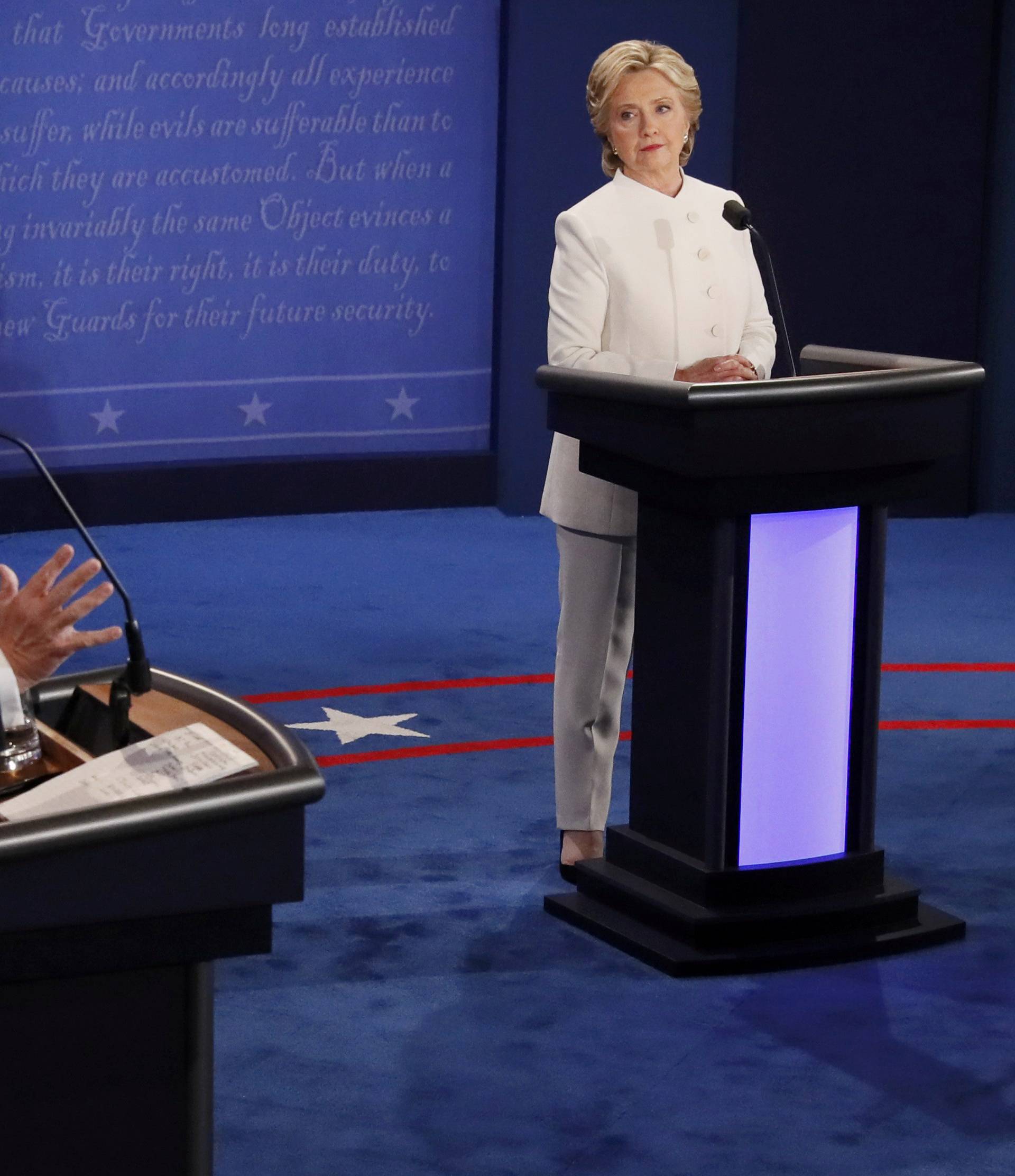 Trump speaks as Clinton listens during their third and final 2016 presidential campaign debate at UNLV in Las Vegas