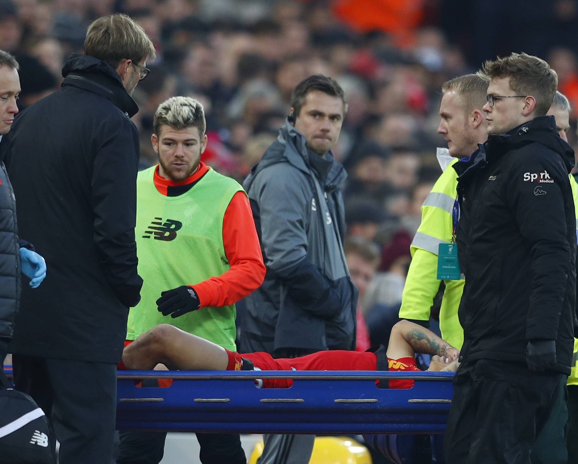 Liverpool's Philippe Coutinho is stretchered off after sustaining an injury as manager Juergen Klopp looks on