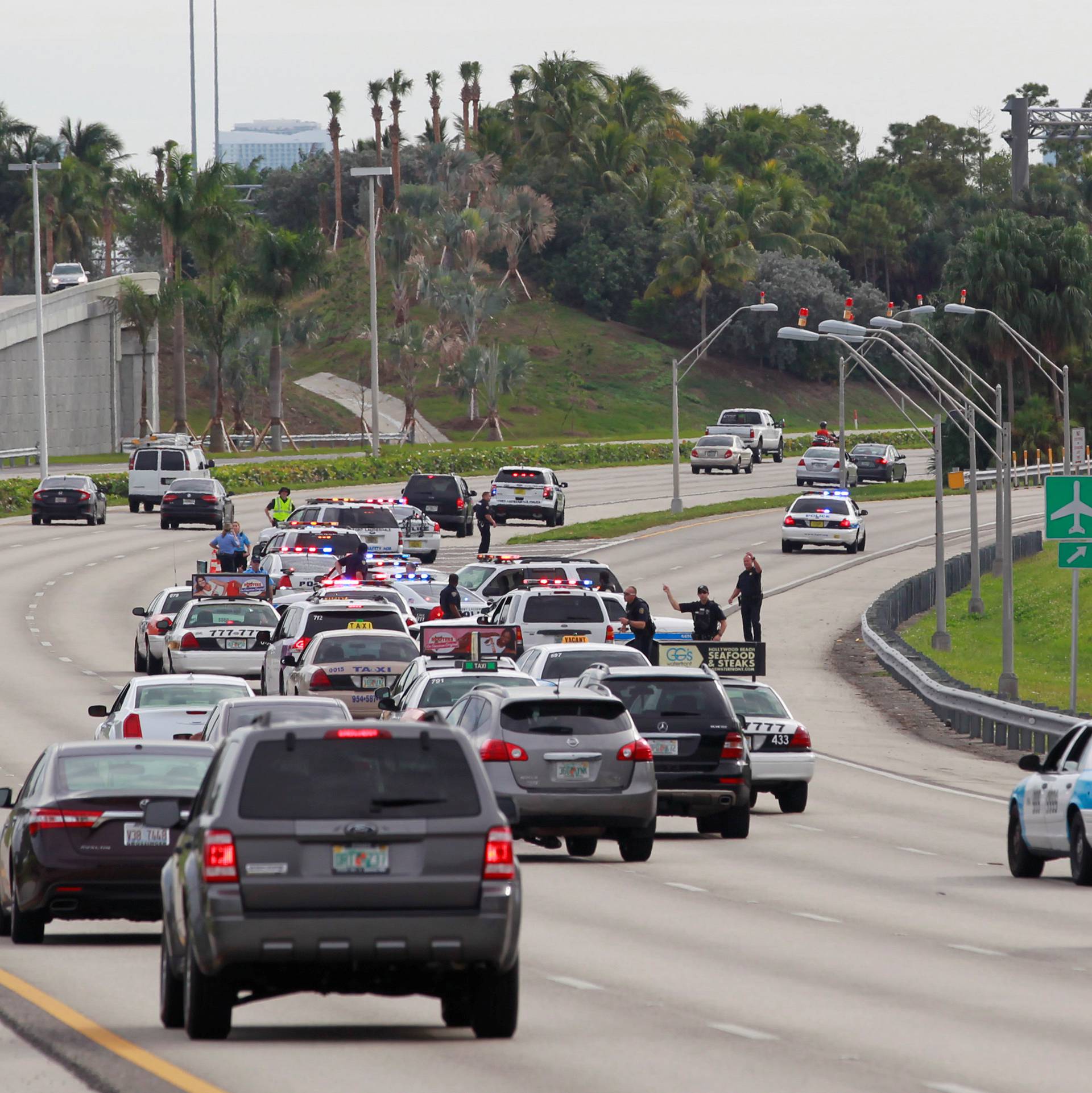 Law enforcement block an entrance to the airport following a shooting incident at Fort Lauderdale-Hollywood International Airport in Fort Lauderdale, Florida