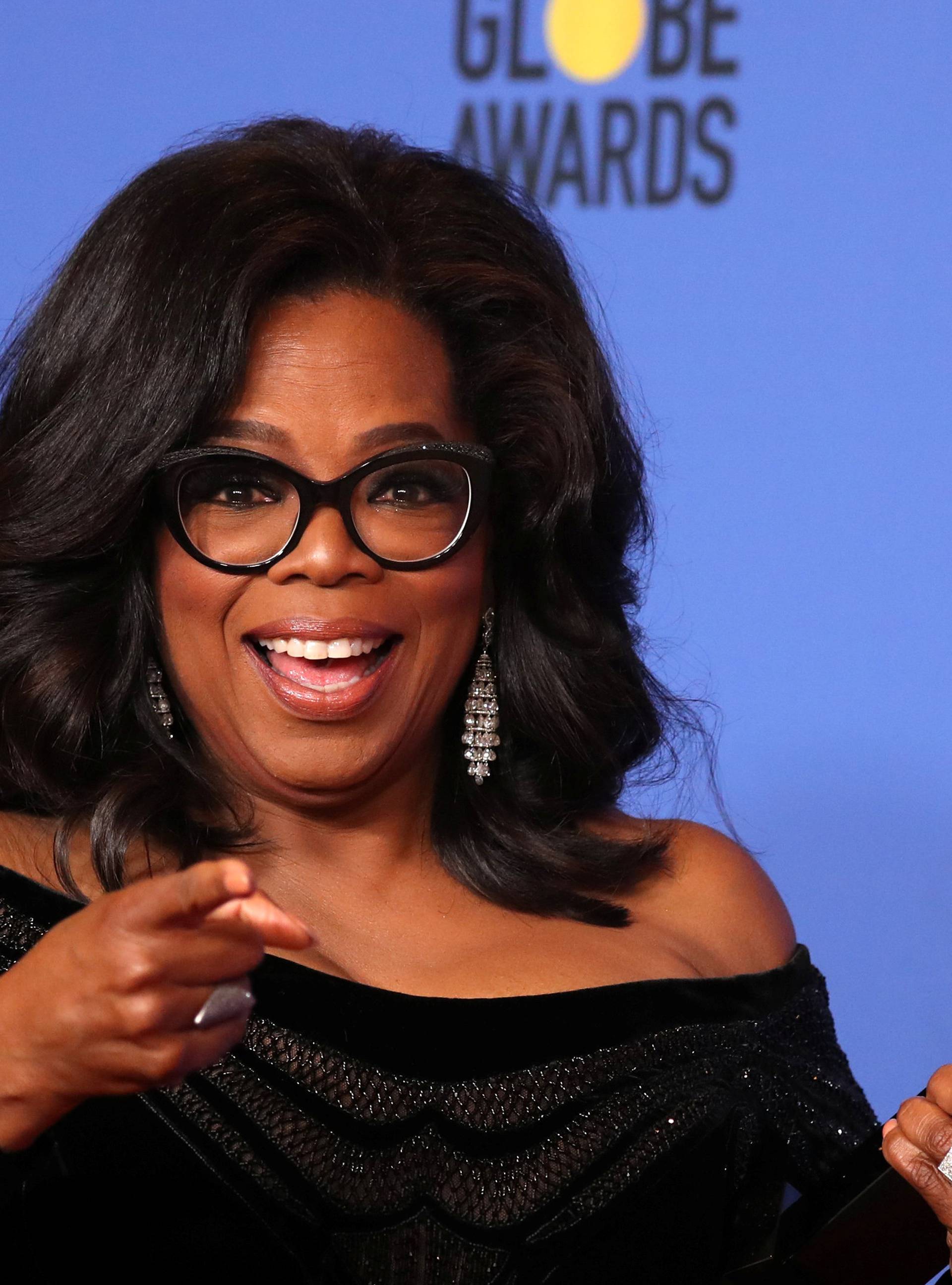 FILE PHOTO: Oprah Winfrey with her Cecil B. DeMille Award at the 75th Golden Globe Awards in Beverly Hills