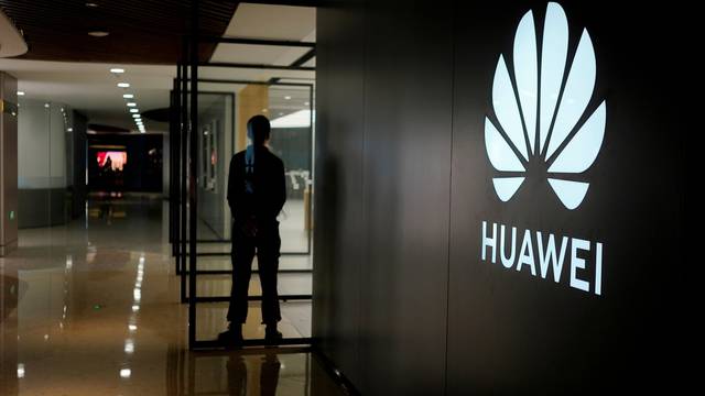 FILE PHOTO: A Huawei company logo is seen at a shopping mall in Shanghai