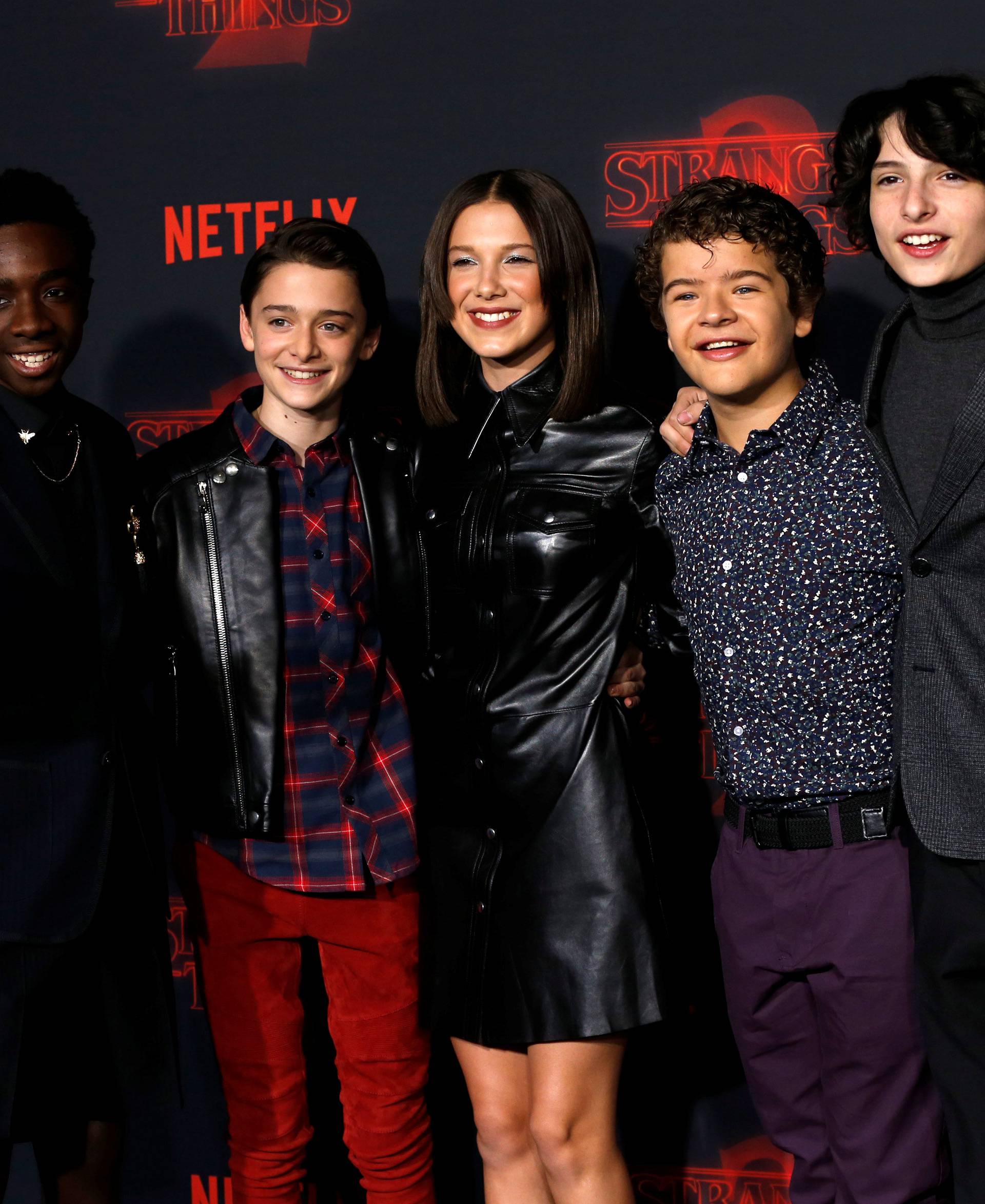 Cast members McLaughlin, Schnapp, Brown, Matarazzo and Wolfhard pose at the premiere for the second season of the television series "Stranger Things" in Los Angeles