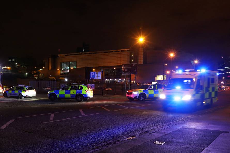 Police vehicles are seen outside the Manchester Arena, where U.S. singer Ariana Grande had been performing, in Manchester, northern England, Britain