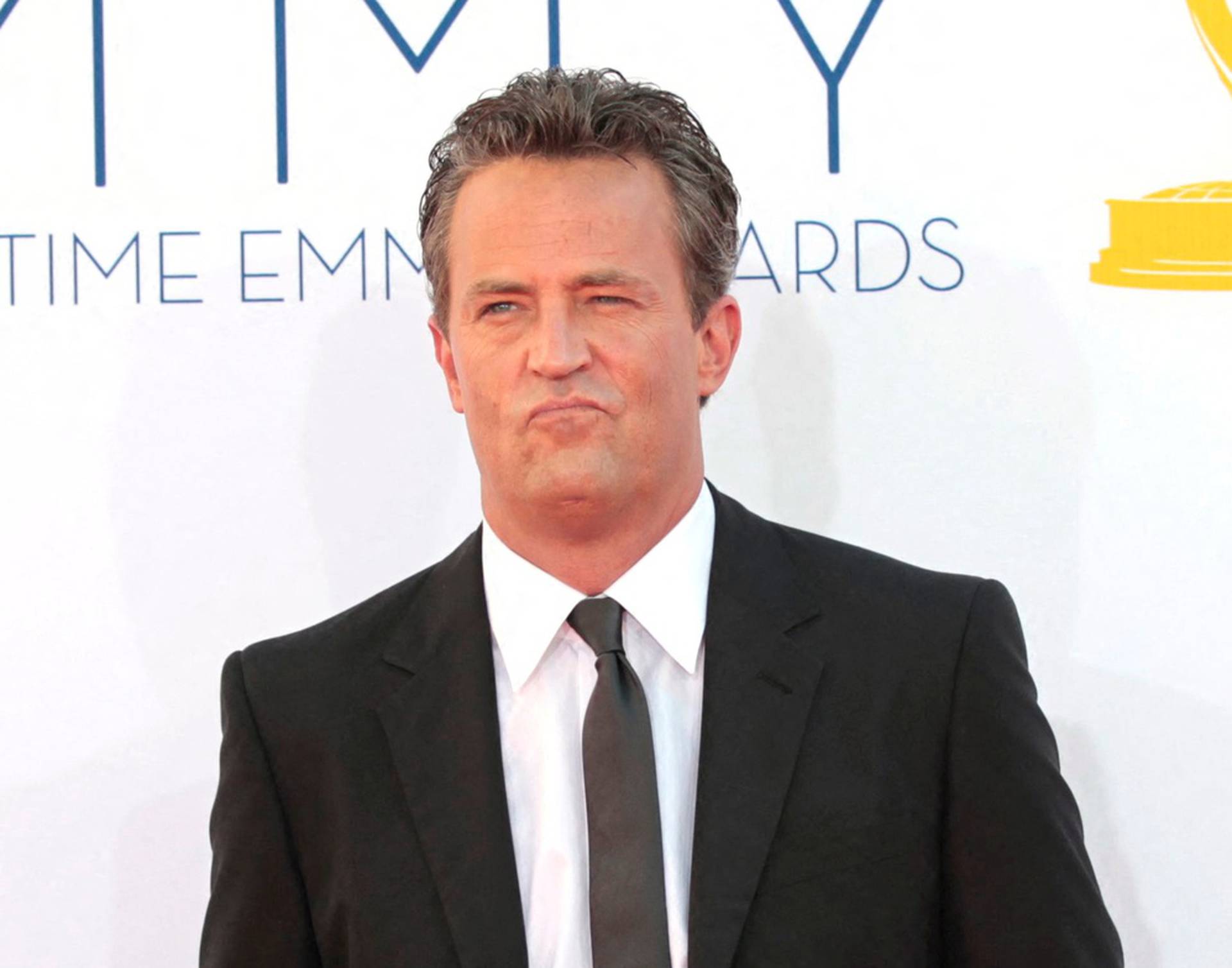 FILE PHOTO: Actor Matthew Perry arrives at the 64th Primetime Emmy Awards in Los Angeles