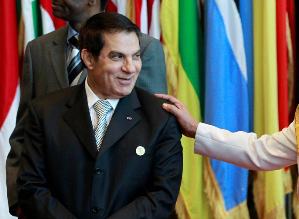 FILE PHOTO: Tunisia's President Ben Ali meets Libya's leader Muammar Gaddafi during an EU-Africa summit in Tripoli