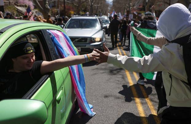 People participate in a protest, in a demonstration that is part of larger "Hands off" events organized nationwide against U.S. President Trump, in Salt Lake City