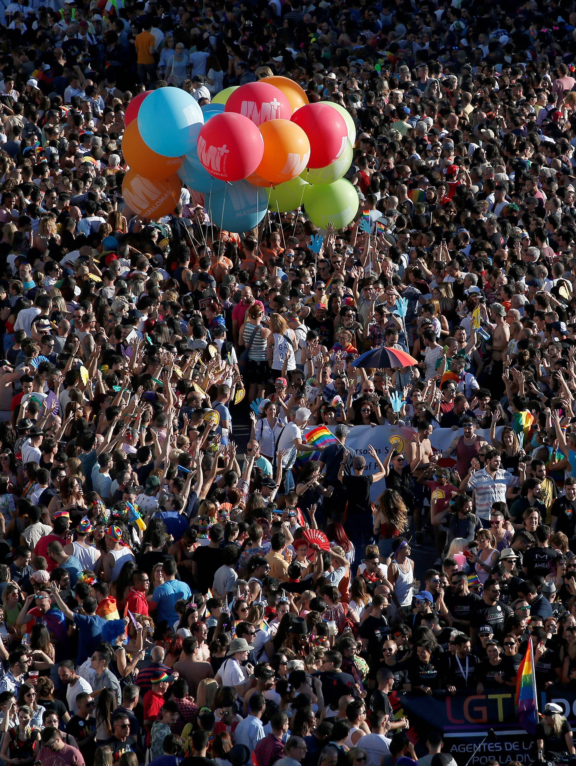 Revellers attend the World Pride parade in Madrid