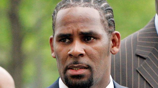 FILE PHOTO: Recording artist R. Kelly arrives at the Cook County Criminal Courthouse for the first day of his trial in Chicago