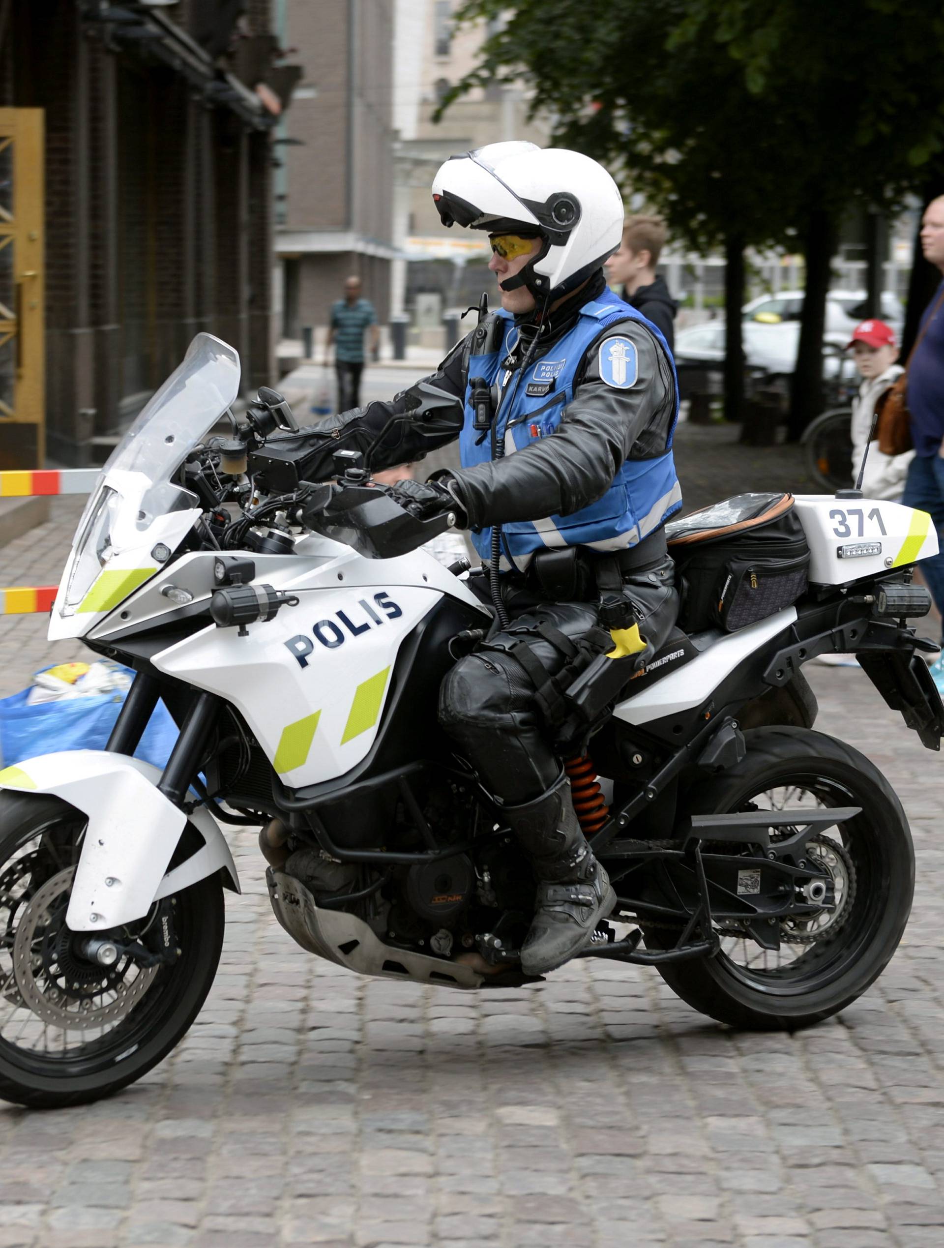 Finnish police patrols on motorbike after stabbings in Turku, in Central Helsinki
