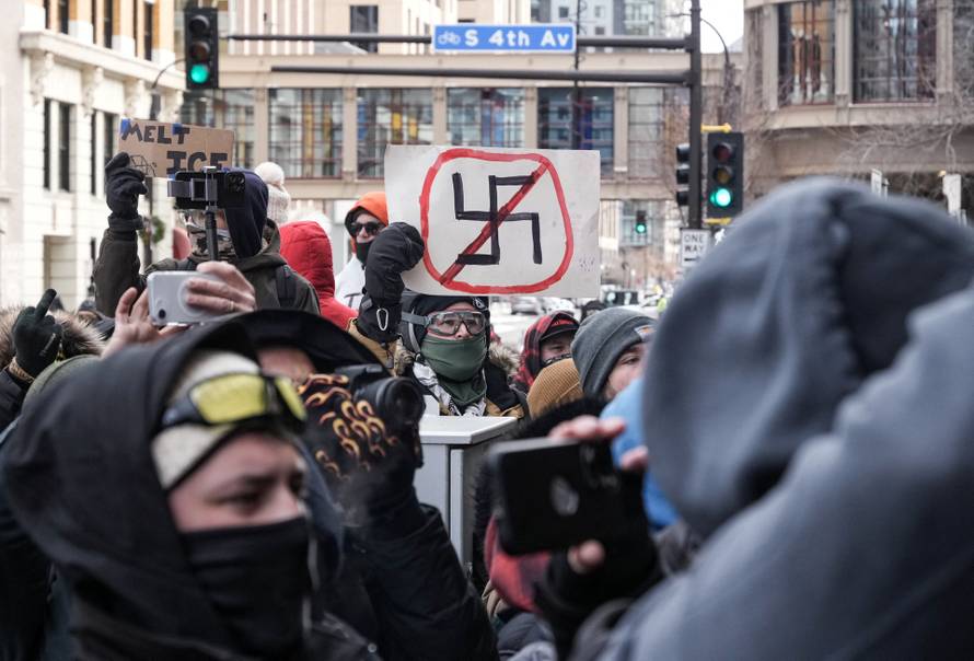 People attend the "March Against Minnesota Fraud" in Minneapolis