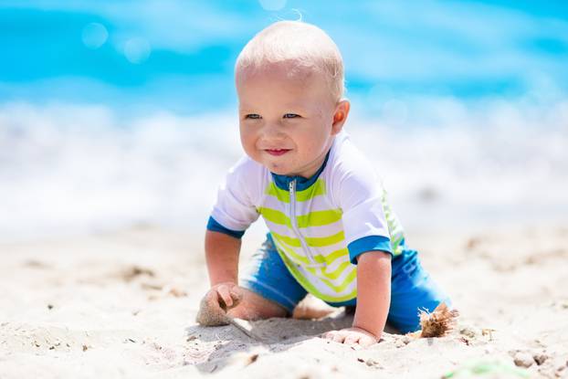 Baby boy on tropical beach