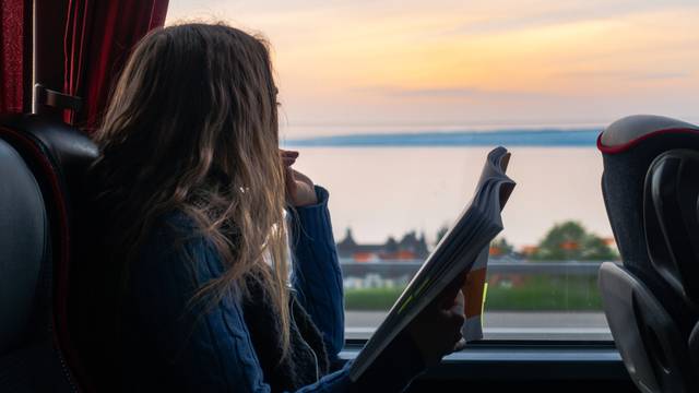 Girl,Looking,Out,Window,Reading,Bus,Sunset,Landscape,Peaceful,Single