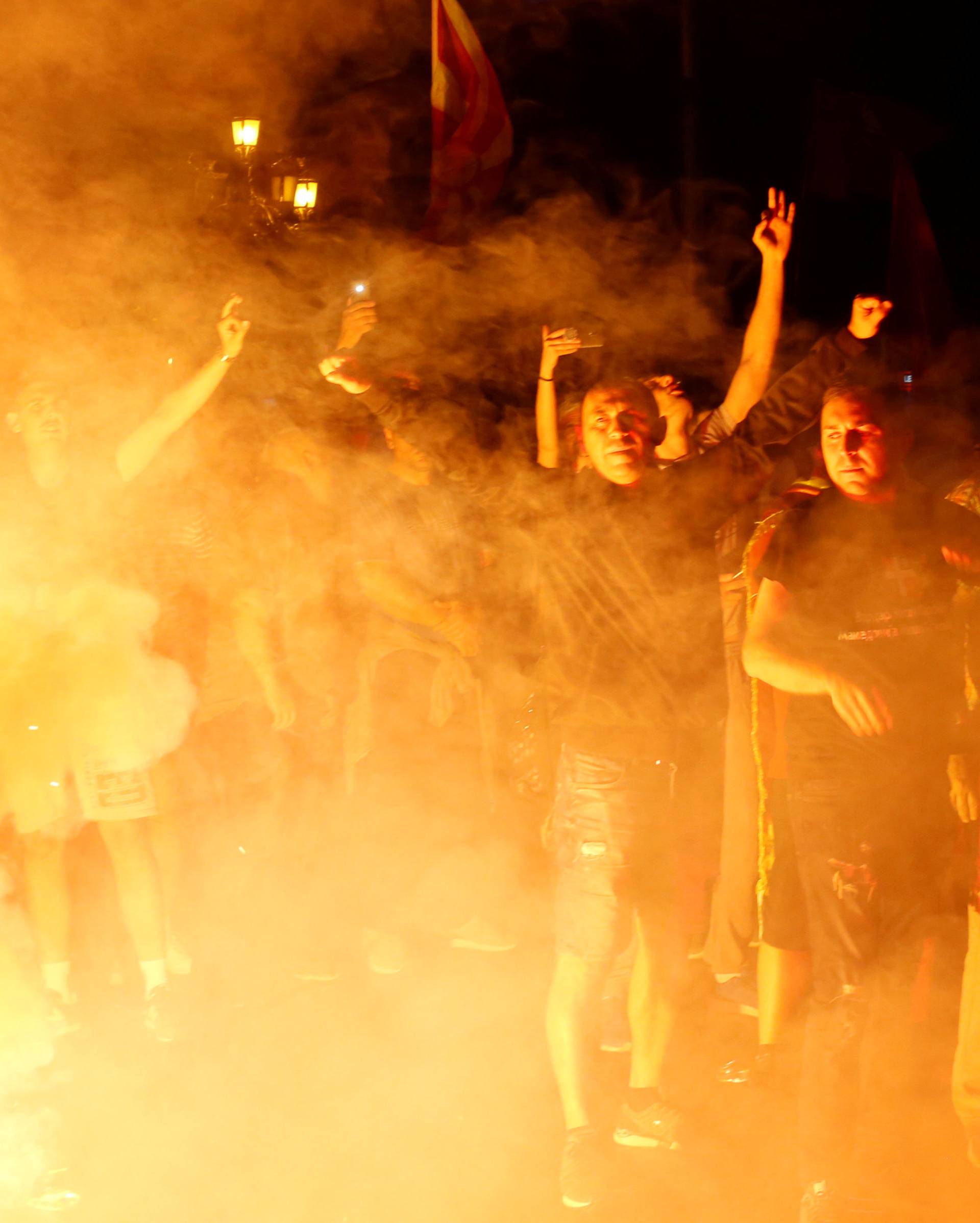 Protestors shout slogans against the change of the country's constitutional name in front of the Parliament building in Skopje