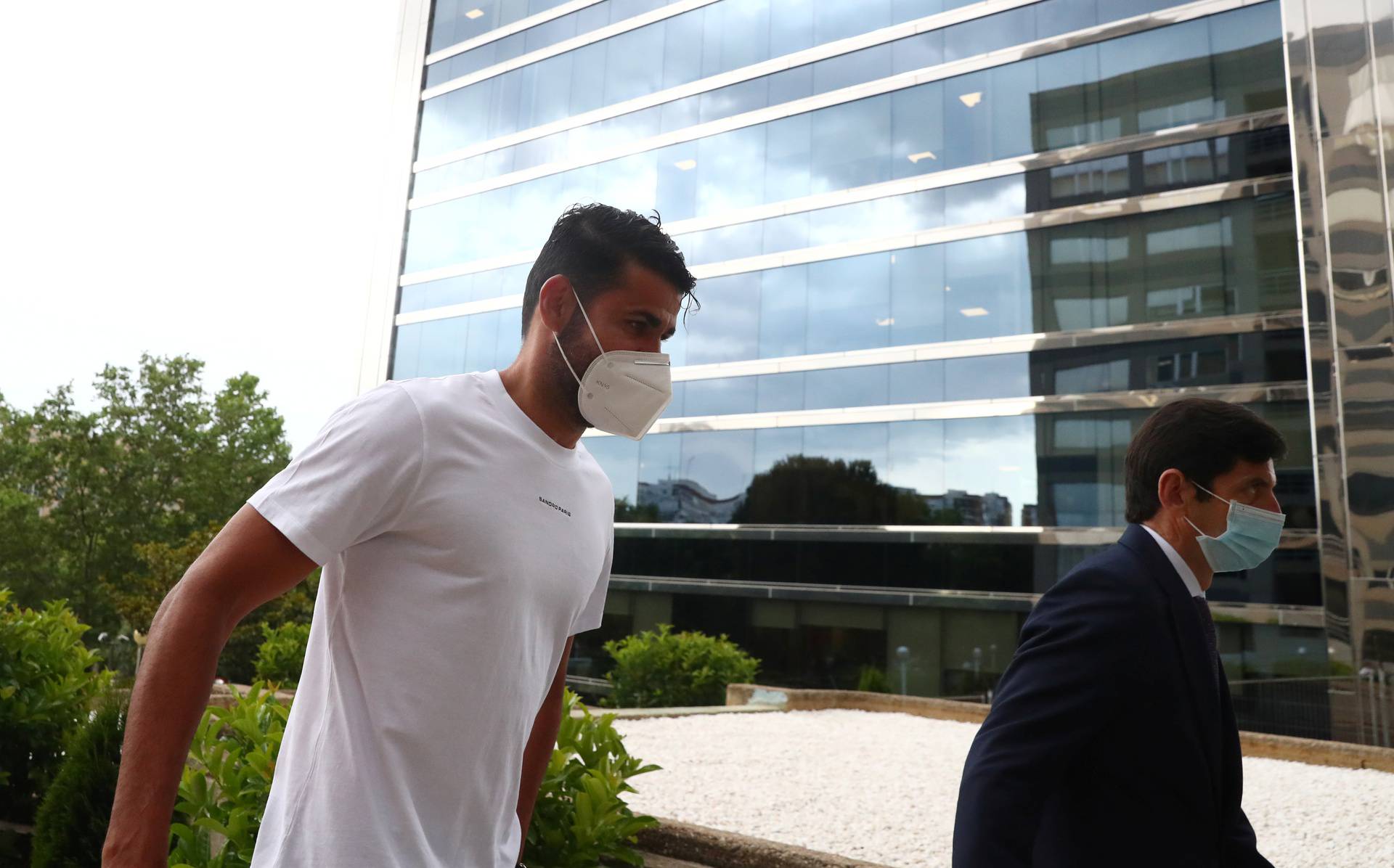 Atletico Madrid's Diego Costa arrives at a court to attend a trial for tax fraud