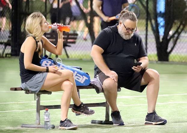 *EXCLUSIVE* Russell Crowe gets cozy with a younger woman while spending time at the tennis courts in Sydney!