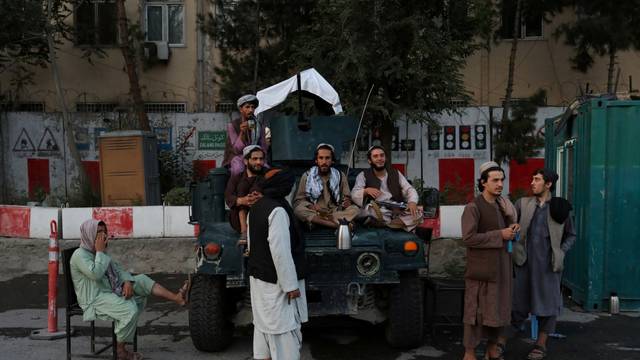 Taliban soldiers are seen at one of the main city squares of Kabul
