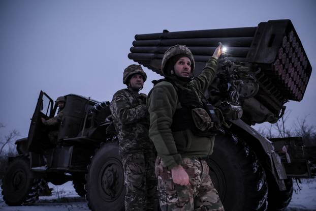 Ukrainian servicemen fire a Grad MLRS towards Russian troops near the frontline town of Chasiv Yar