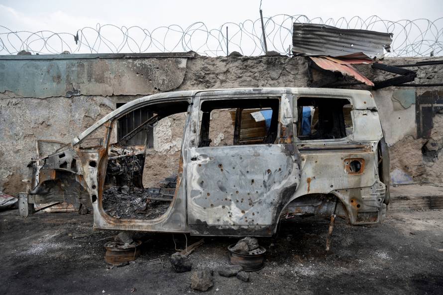 Residents survey damage from fighting between M23 rebels and Congolese forces in Goma