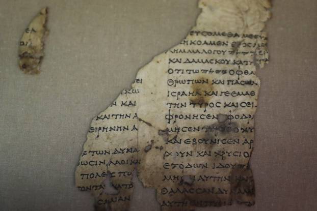 A recently-discovered scroll fragment of an ancient biblical text is seen at Israel Antiquities Authority laboratories in Jerusalem