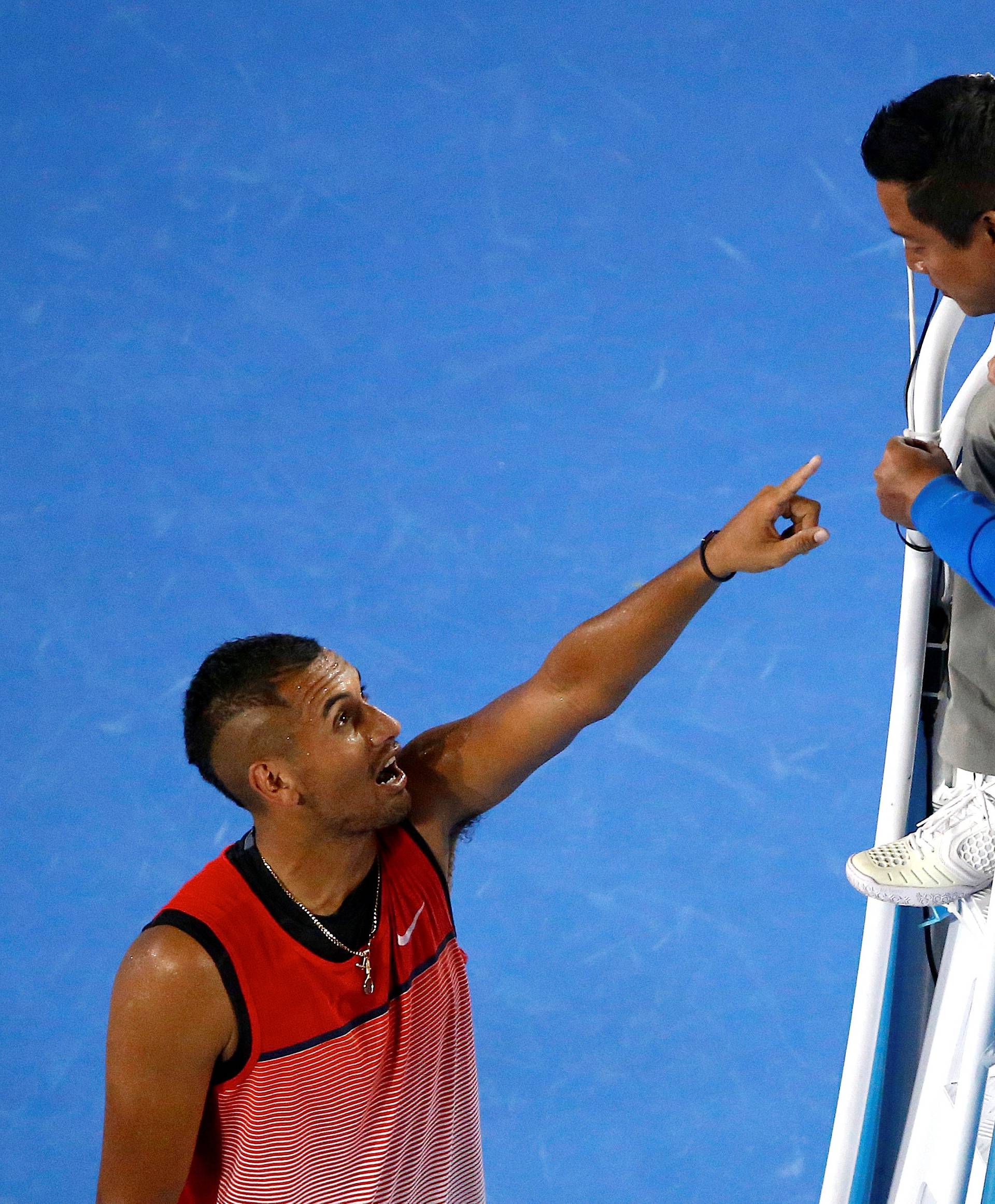 Australia's Kyrgios points at umpire Keothavong as they speak during his third round match against Czech Republic's Berdych at the Australian Open tennis tournament at Melbourne Park