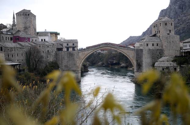Old Bridge is seen with poster which reads: "The old bridge surfaced for the ones who love it" in Mostar