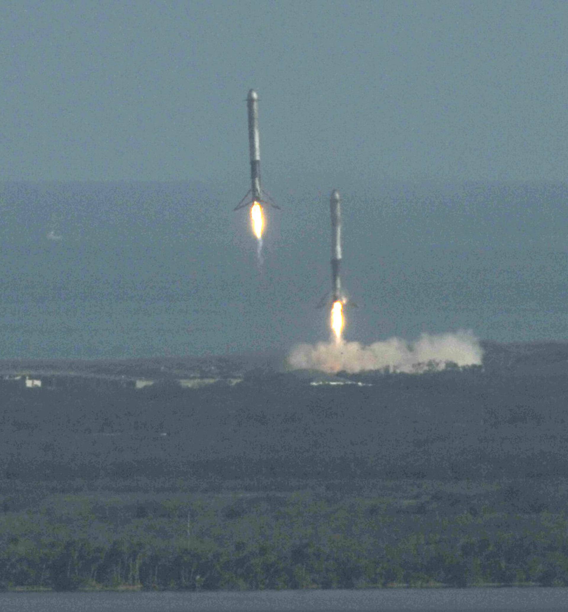 Boosters land after helping launch SpaceX Falcon Heavy rocket from the Kennedy Space Center in Cape Canaveral