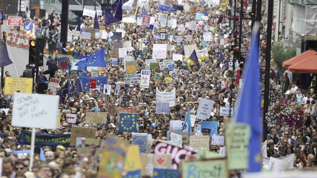 People hold banners during a demonstration against Britain's decision to leave the European Union, in central London