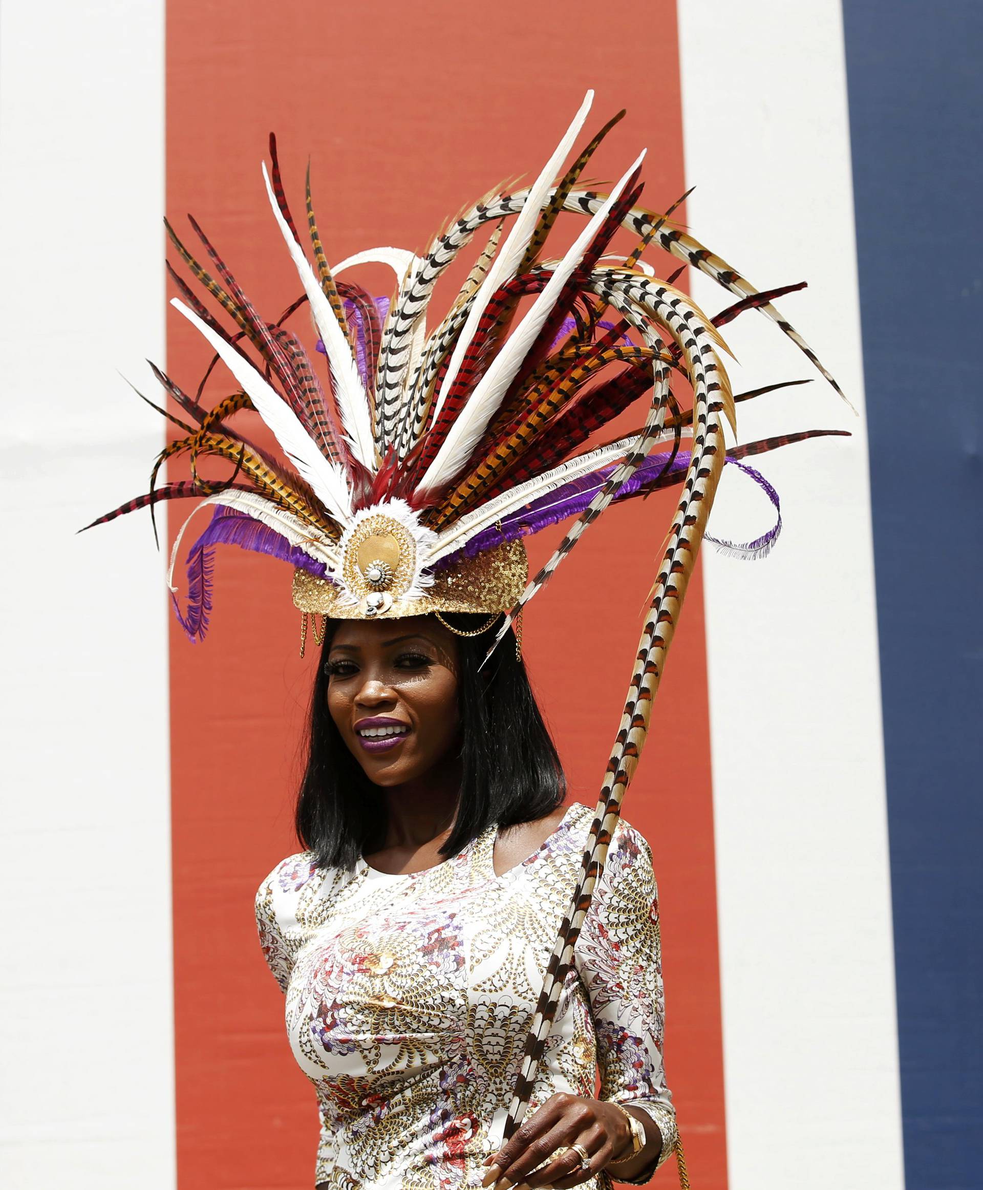 Britain Horse Racing Ladies Day Racegoer wears hat