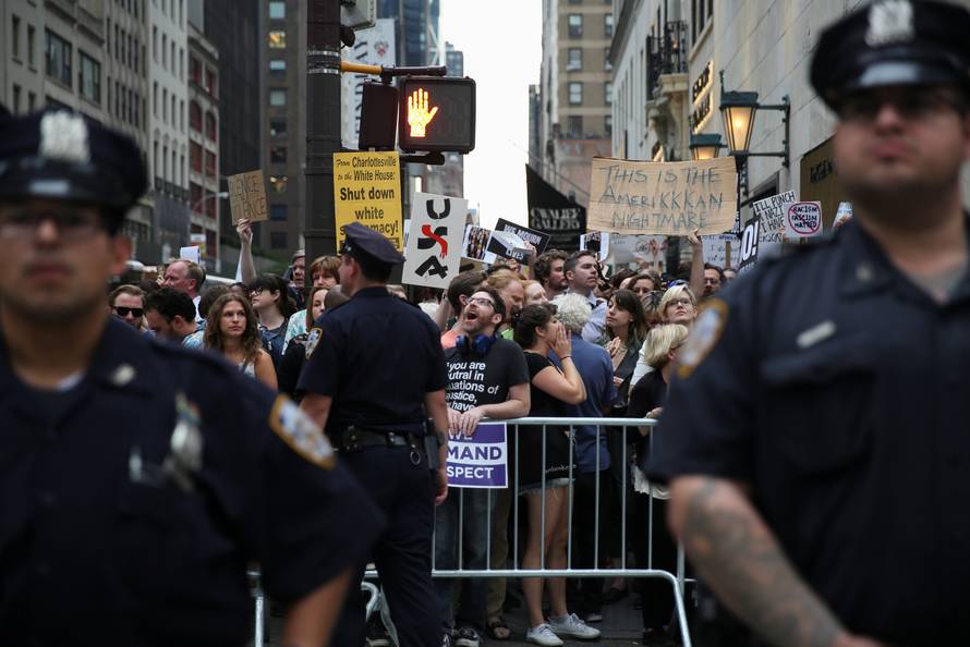 Police cordon off anti-Trump activists ahead of the arrival of U.S. President Donald Trump in Manhattan, New York