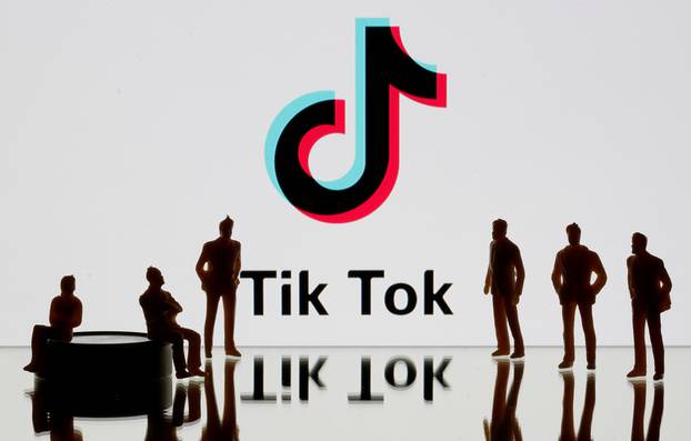 FILE PHOTO: A 3-D printed figures are seen in front of displayed Tik Tok logo in this picture illustration