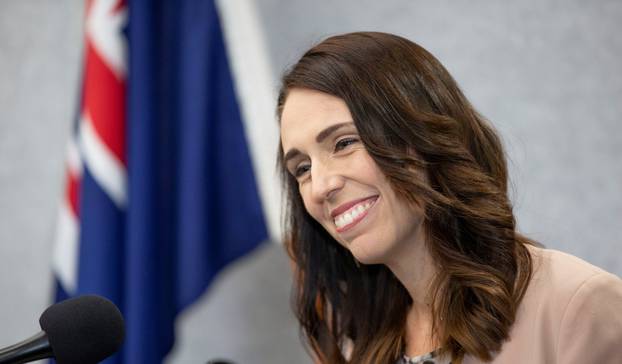 New Zealand Prime Minister Jacinda Ardern smiles during a news conference prior to the anniversary of the mosque attacks that took place the prior year in Christchurch