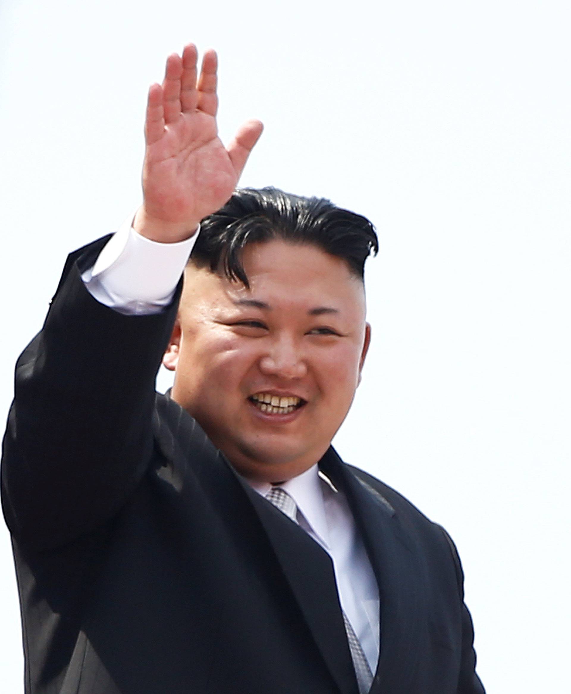 FILE PHOTO:North Korean leader Kim Jong Un waves to people attending a military parade marking the 105th birth anniversary of country's founding father, Kim Il Sung in Pyongyang