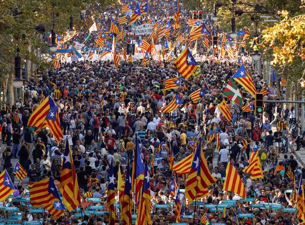 People wave Catalan separatist flags during a demonstration organised by Catalan pro-independence movements ANC (Catalan National Assembly) and Omnium Cutural, following the imprisonment of their two leaders Jordi Sanchez and Jordi Cuixart, in Barcelona