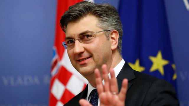 Croatia's Prime Minister Andrej Plenkovic gestures in a government building in Zagreb