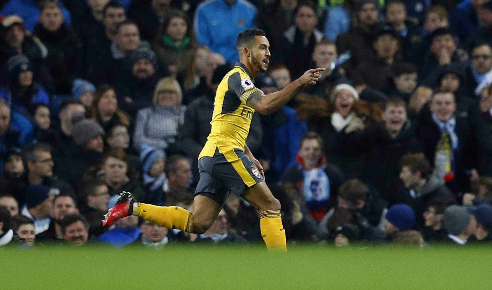 Arsenal's Theo Walcott celebrates scoring their first goal