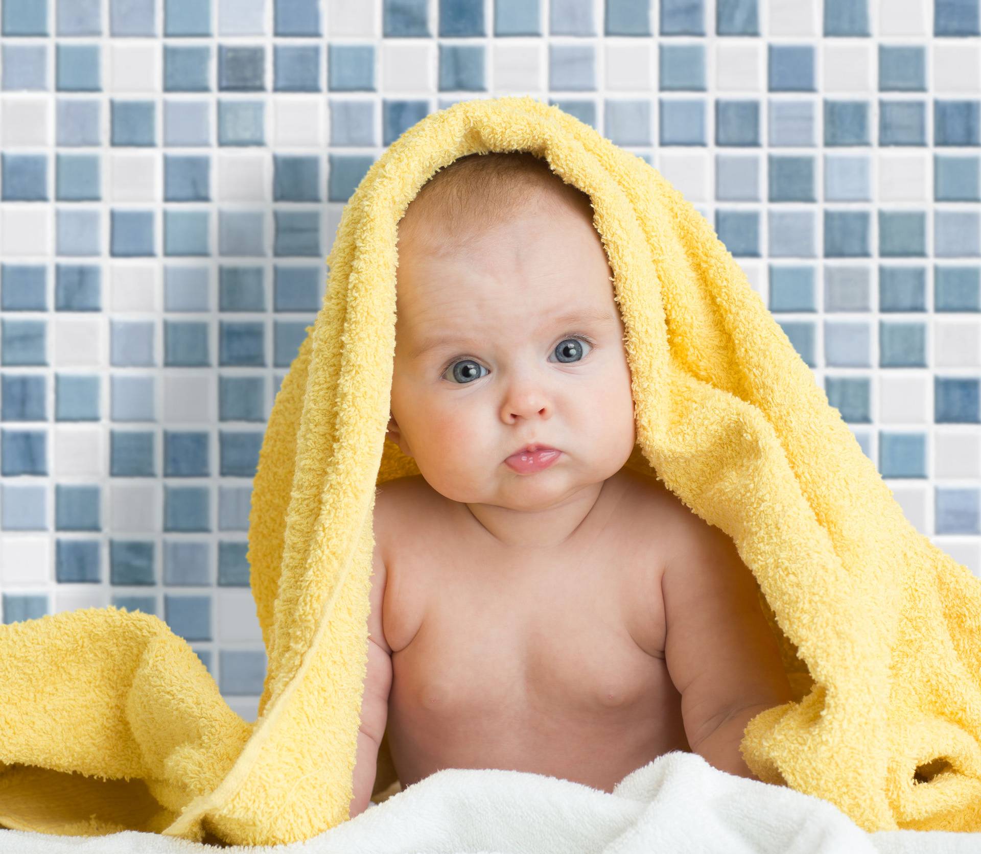 Cute baby in bath towel