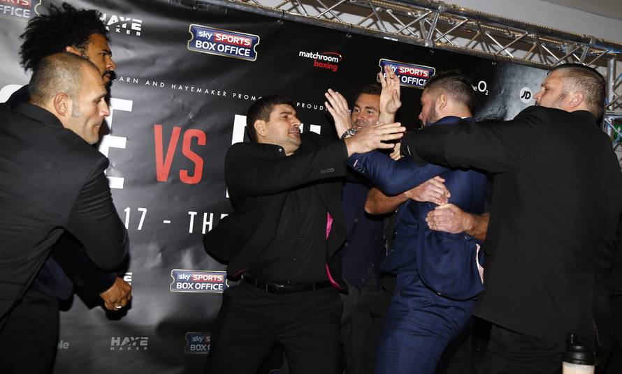 David Haye and Tony Bellew clash after the press conference as promoter Eddie Hearn looks on