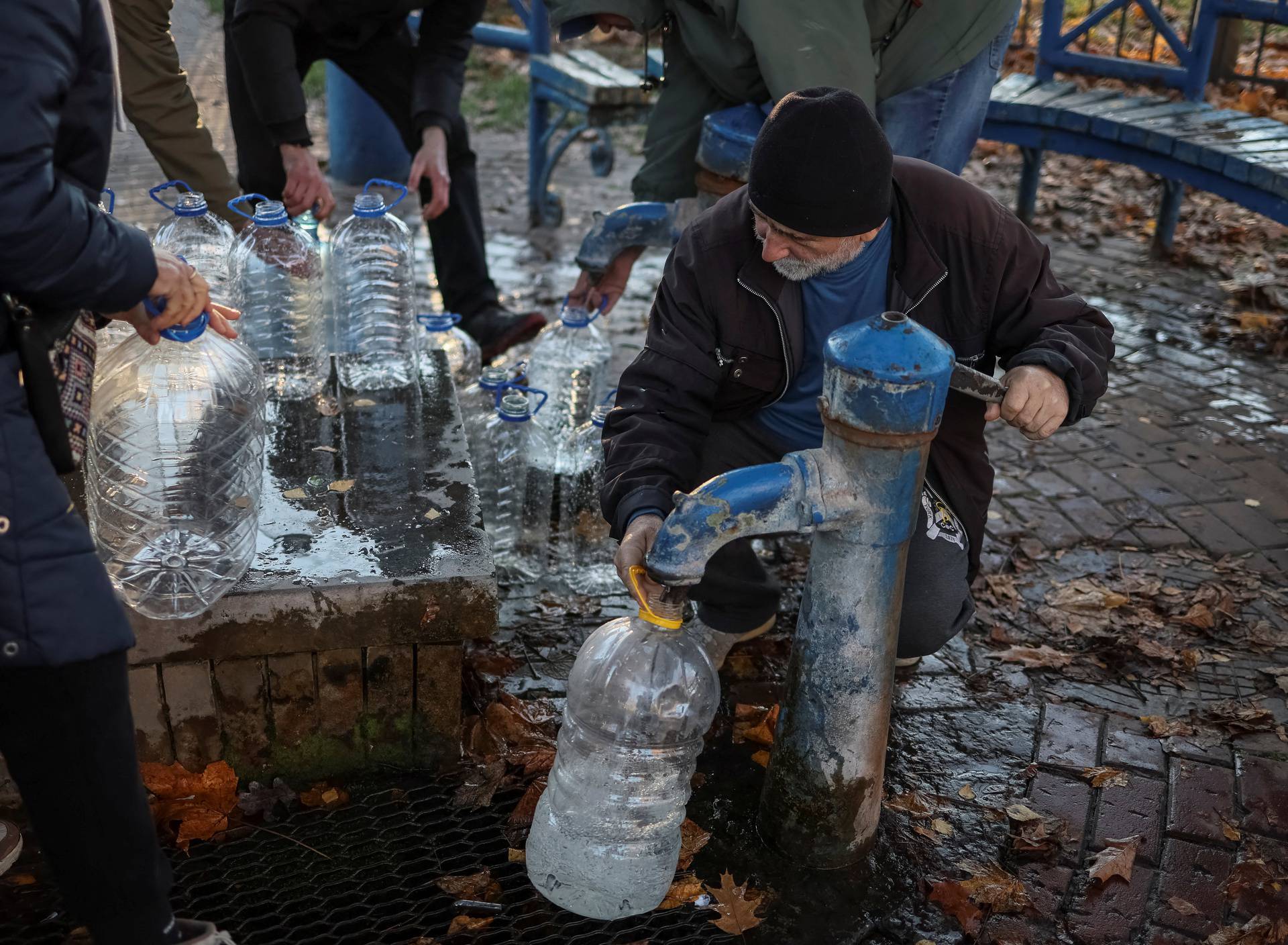 Locak residents queue for water after a Russian missile attack in Kyiv