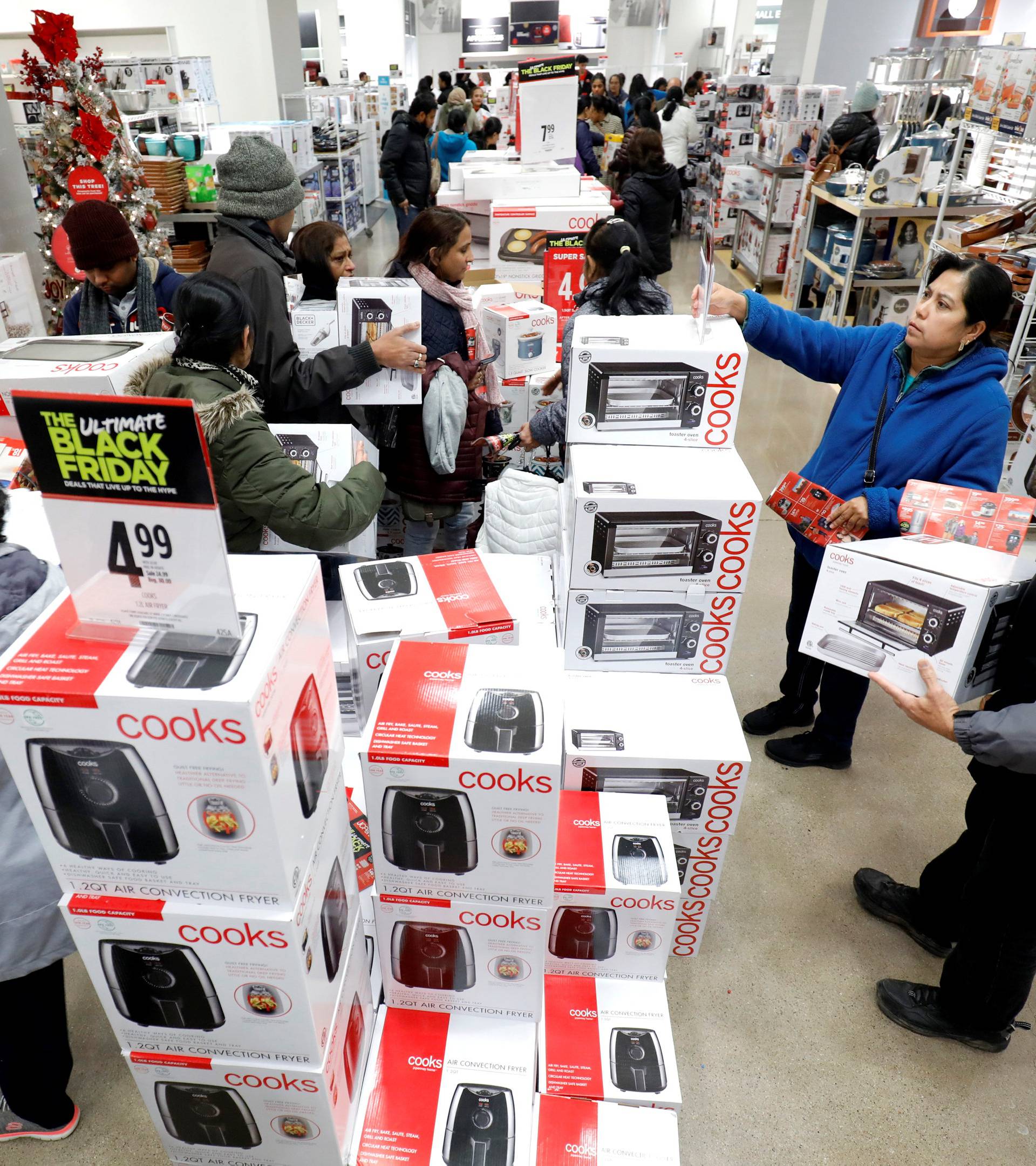 Customers shop for small appliances during the Black Friday sales event on Thanksgiving Day at JCPenney in Niles