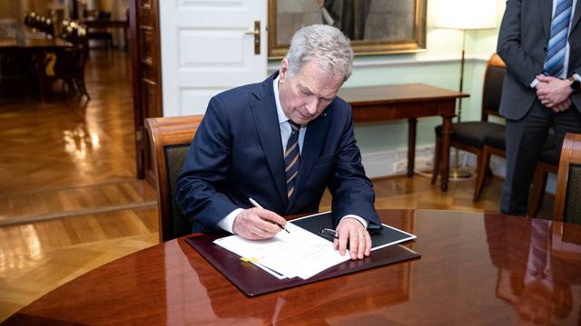 Finnish President Sauli Niinisto signs Finnish NATO legislation in Helsinki