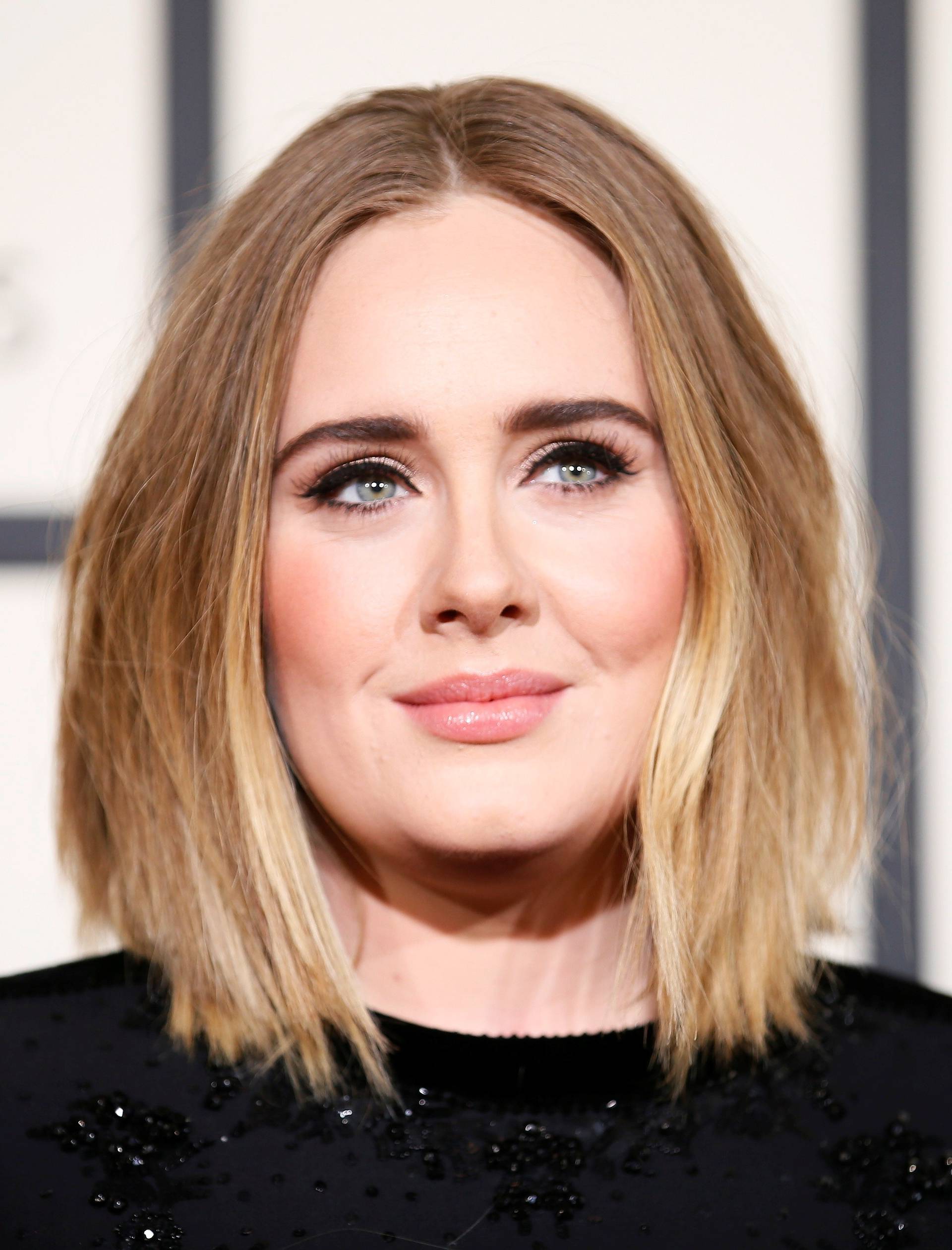 FILE PHOTO: Adele arrives at the 58th Grammy Awards in Los Angeles