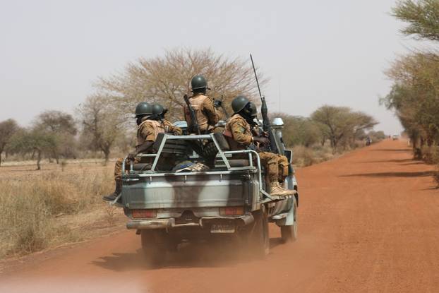 FILE PHOTO: Soldiers from Burkina Faso patrol on the road of Gorgadji in the Sahel region, Burkina Faso