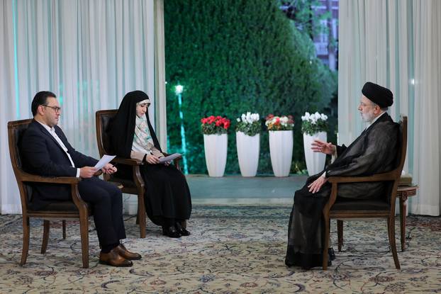 Iranian President Ebrahim Raisi attends a TV interview in Tehran